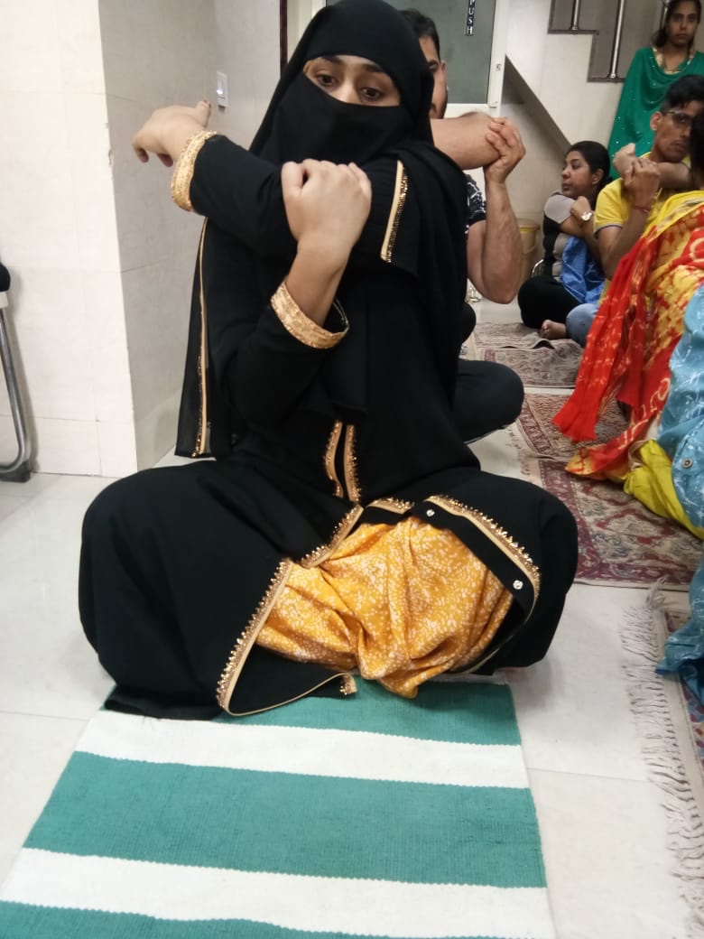 A muslim women doing Group exercise